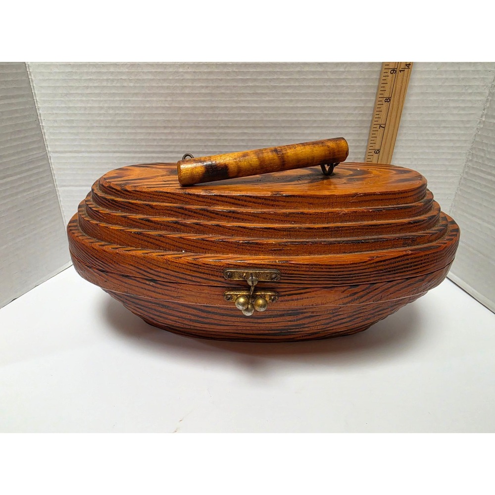 beehive" style vintage handbag.It features a wooden, multi-layered oval